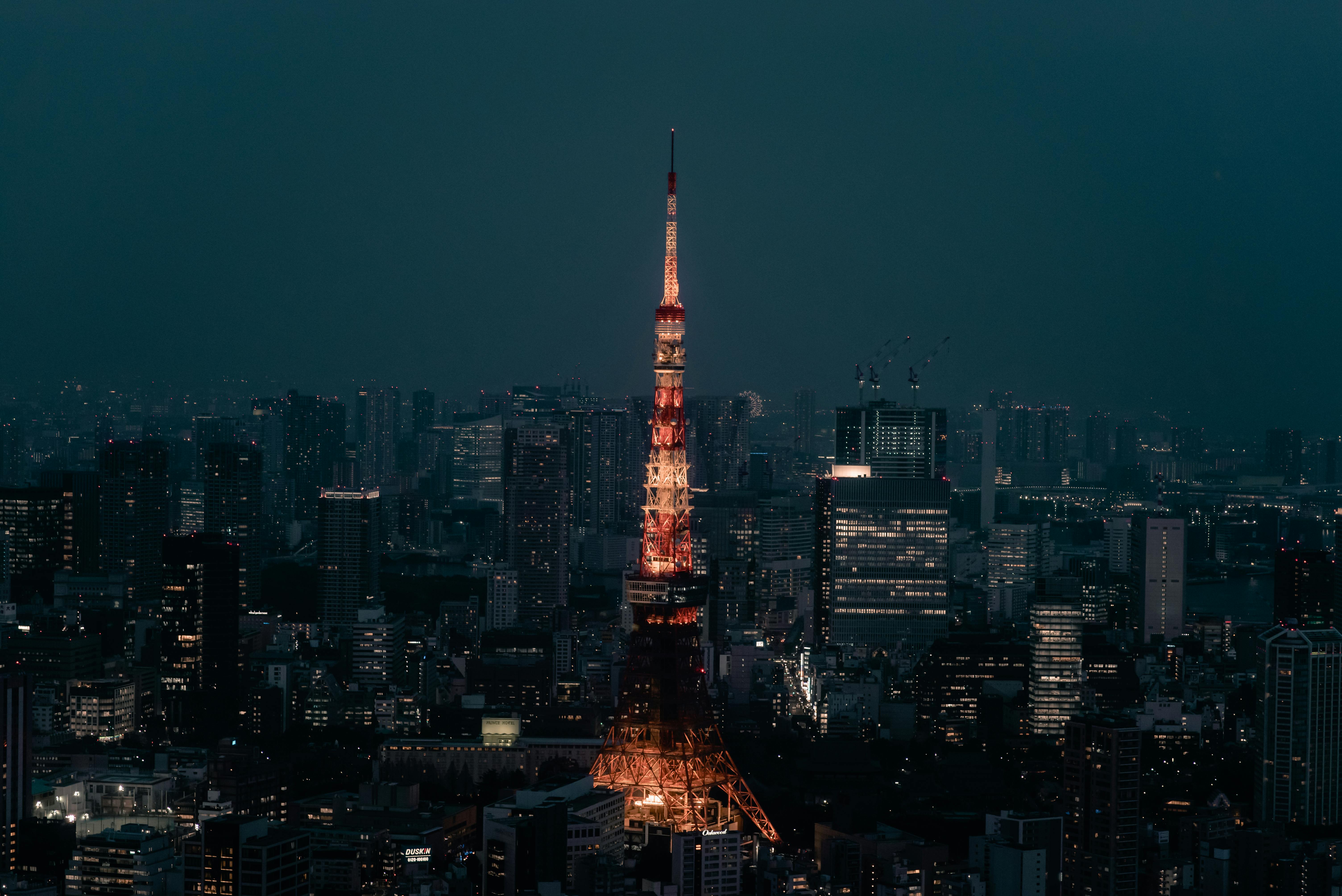 Tokyo Tower glowing red and white over the night city skyline