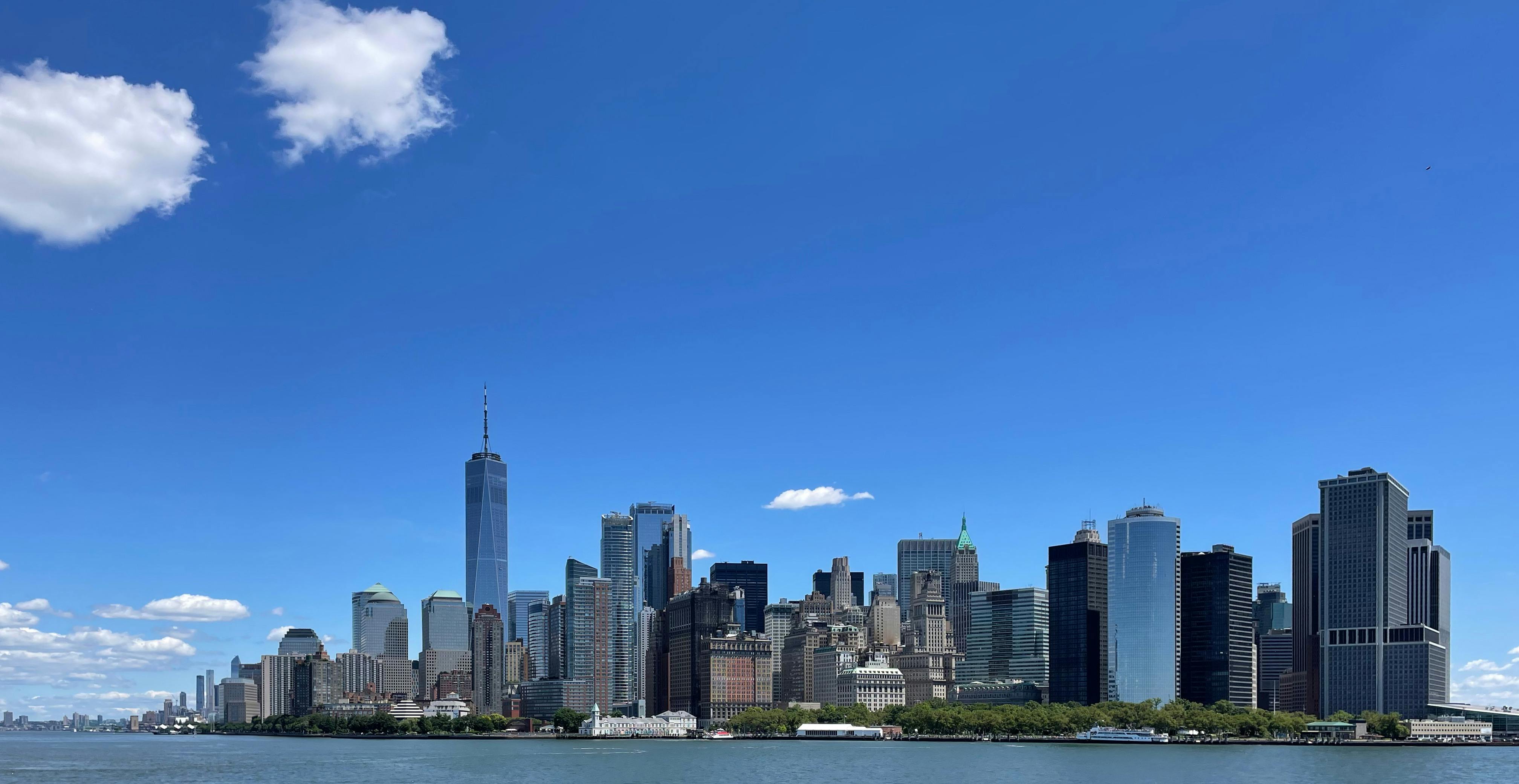 Lower Manhattan skyline on a sunny day viewed from across the water