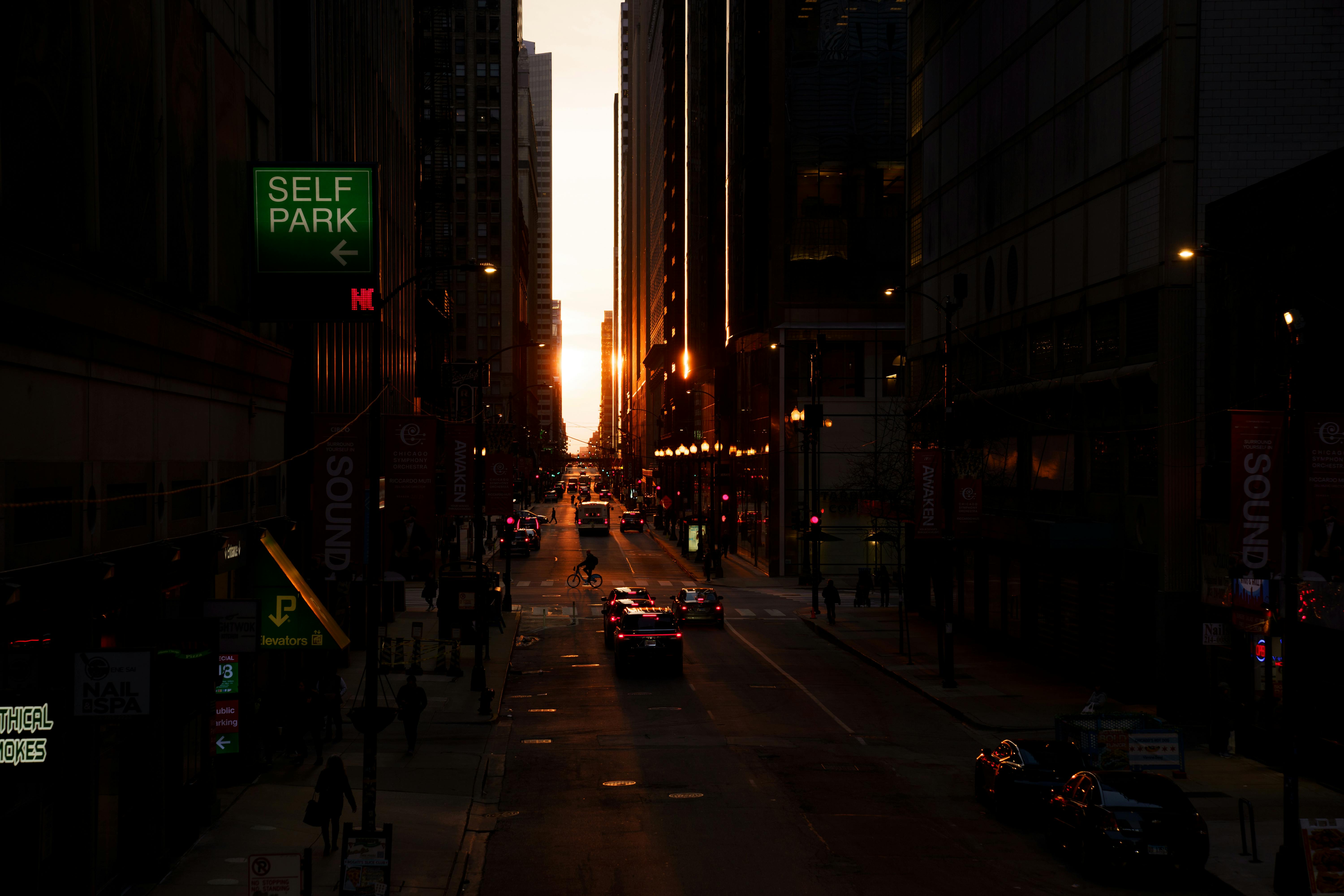 Sunset blazing through a Chicago canyon street between skyscrapers